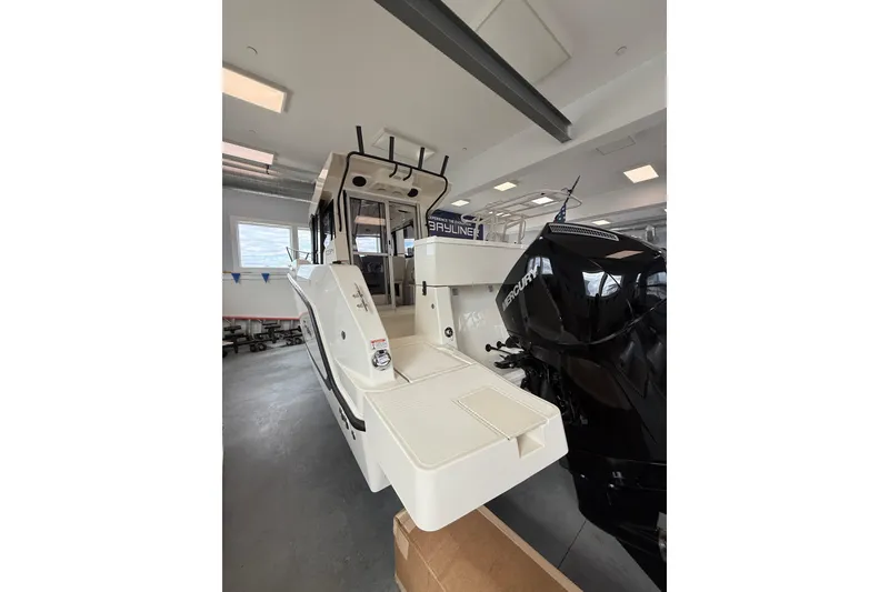 Slide: The Image of 2025 Bayliner Trophy T23 Pilothouse interior, showcasing spacious deck and modern design. - 3
