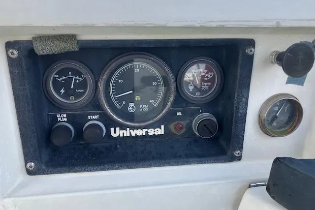 Slide: The Image of Control panel of a 1990 C&C 30-2 sailboat with Universal engine gauges. - 13