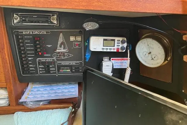 Slide: The Image of Control panel of a 1990 C&C 30-2 sailboat with navigation and communication equipment. - 15
