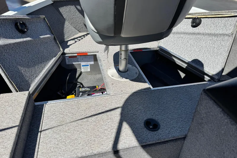 Slide: The Image of 2020 Alumacraft Escape 165 SC boat interior with open storage compartments. - 12