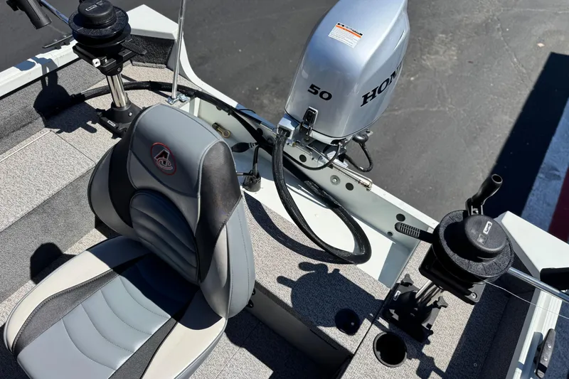Slide: The Image of 2020 Alumacraft Escape 165 SC boat interior with Honda 50 outboard motor and seating. - 18
