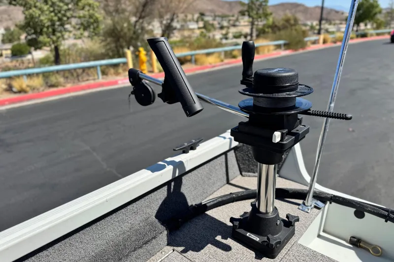 Slide: The Image of 2020 Alumacraft Escape 165 SC boat with fishing rod holder on deck. - 19