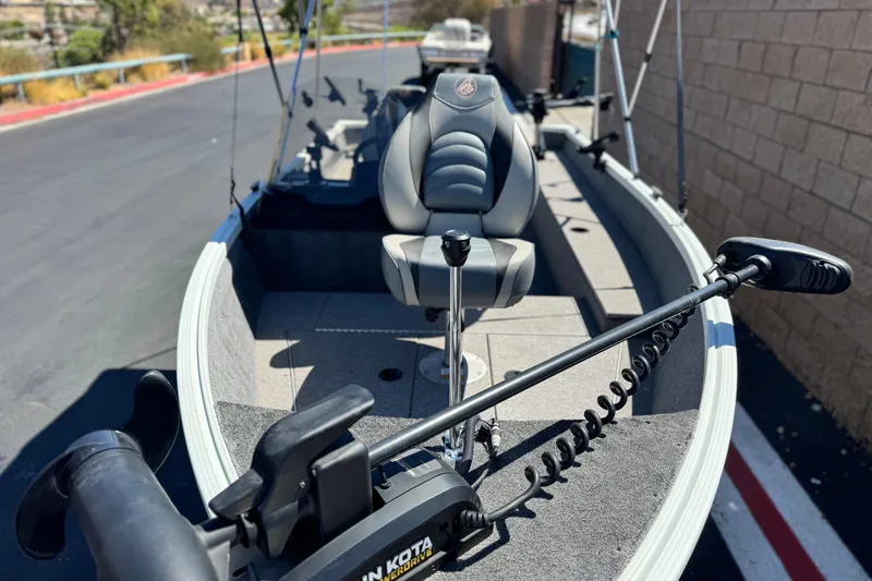 Slide: The Image of 2020 Alumacraft Escape 165 SC boat with trolling motor and seating. - 7