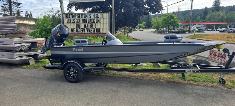 The Image of 2025 Excel 1860 Stalker SC boat on trailer, parked roadside, for sale sign visible. - 0
