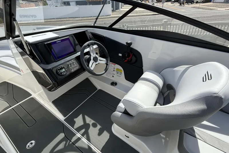 Slide: The Image of 2025 Bayliner V20 boat interior with modern dashboard and steering wheel. - 10