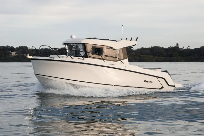 Slide: The Image of Manufacturer Provided Image: 2025 Bayliner Trophy T25 Pilothouse cruising on water, side view. - 3