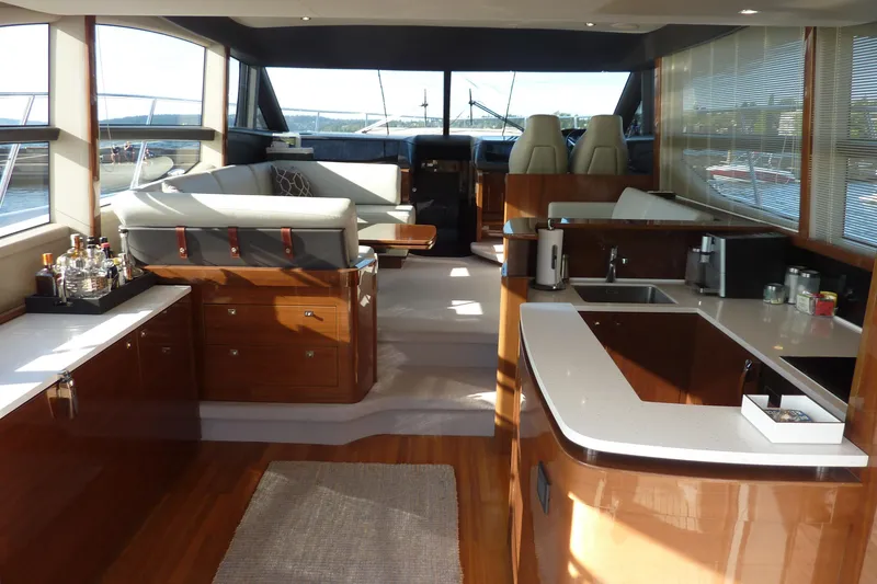 Slide: The Image of Luxurious interior of a 2017 Princess 52 yacht with modern kitchen and seating area. - 11