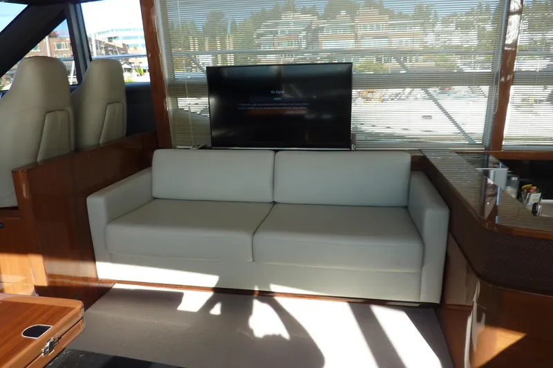 Slide: The Image of Luxurious interior of 2017 Princess 52 yacht with white sofa and TV. - 26