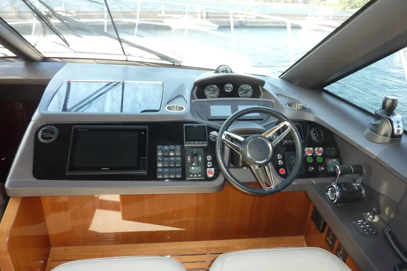 Slide: The Image of Helm of 2017 Princess 52 yacht with modern navigation controls and steering wheel. - 35
