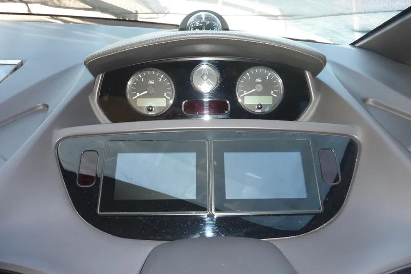 Slide: The Image of Dashboard of a 2017 Princess 52 yacht with dual screens and gauges. - 37