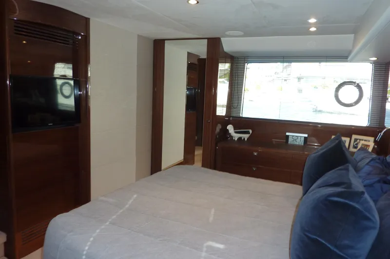 Slide: The Image of Luxurious bedroom interior of 2017 Princess 52 yacht with modern decor and large window. - 45