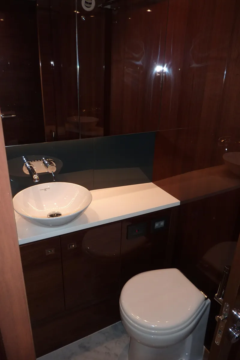 Slide: The Image of Luxurious bathroom in 2017 Princess 52 yacht with modern fixtures and elegant wood finish. - 48