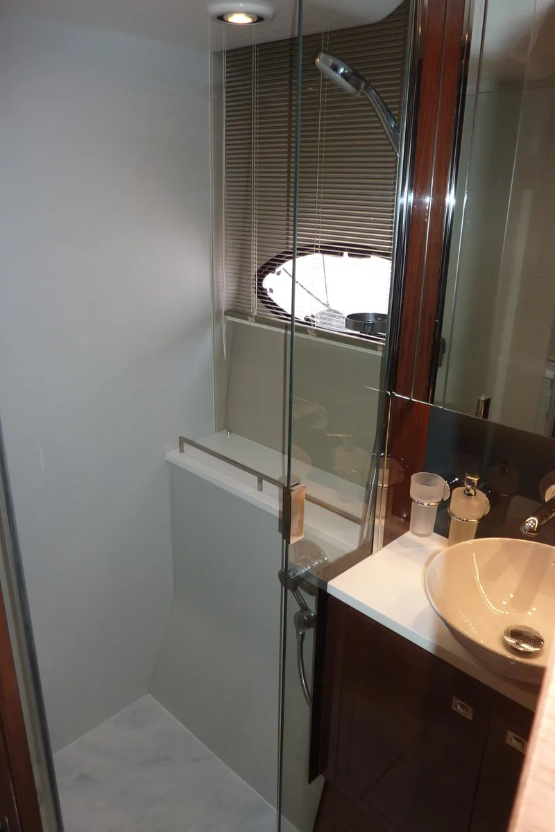 Slide: The Image of Luxurious bathroom in 2017 Princess 52 yacht with modern fixtures and glass shower. - 49