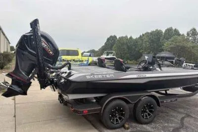 Slide: The Image of 2026 Skeeter ZXE21 boat on trailer, featuring sleek design and powerful engine. - 3