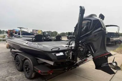 Slide: The Image of 2026 Skeeter ZXE21 boat on trailer, featuring sleek design and powerful outboard motor. - 5