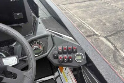 Slide: The Image of 2026 Skeeter ZXE21 boat dashboard with control panel and steering wheel. - 9