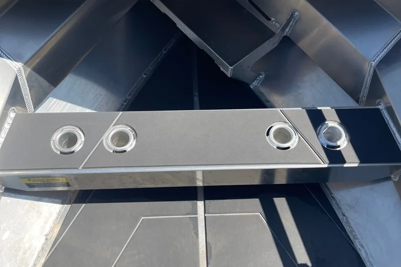 Slide: The Image of 2024 Stabicraft 1450 Frontier interior detail with cup holders and metal finish. - 10