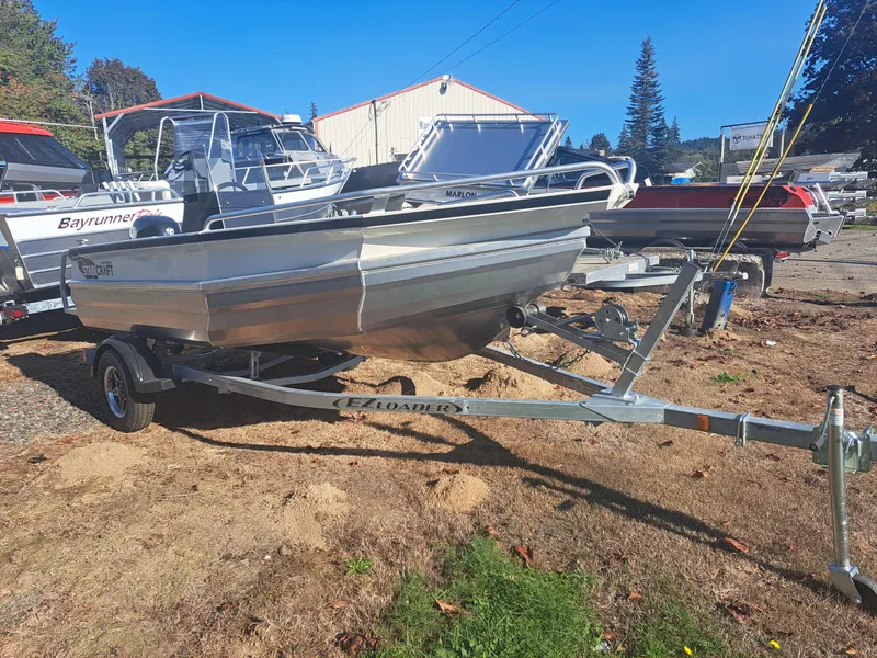 Slide: The Image of 2024 Stabicraft 1450 Frontier boat on trailer in outdoor setting. - 2