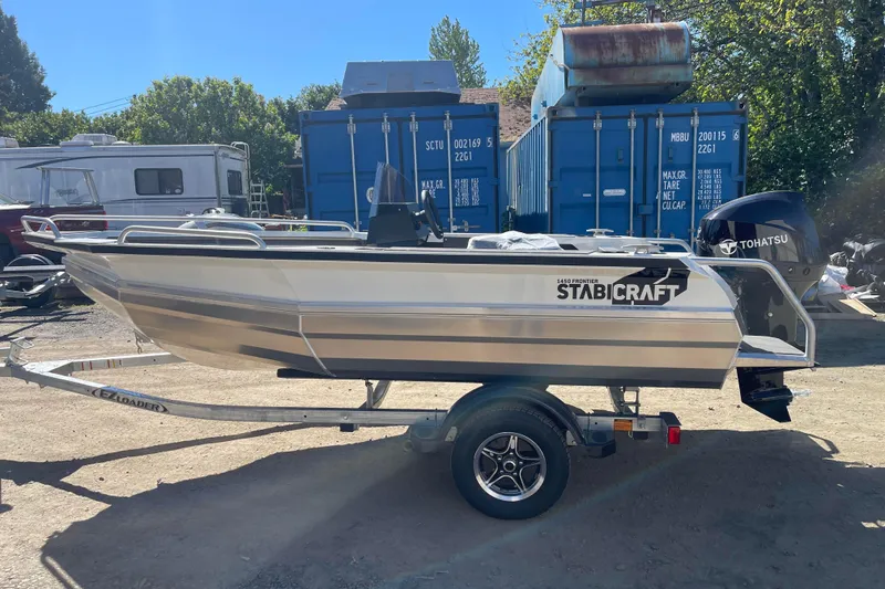 Slide: The Image of 2024 Stabicraft 1450 Frontier boat on trailer, parked outdoors. - 4