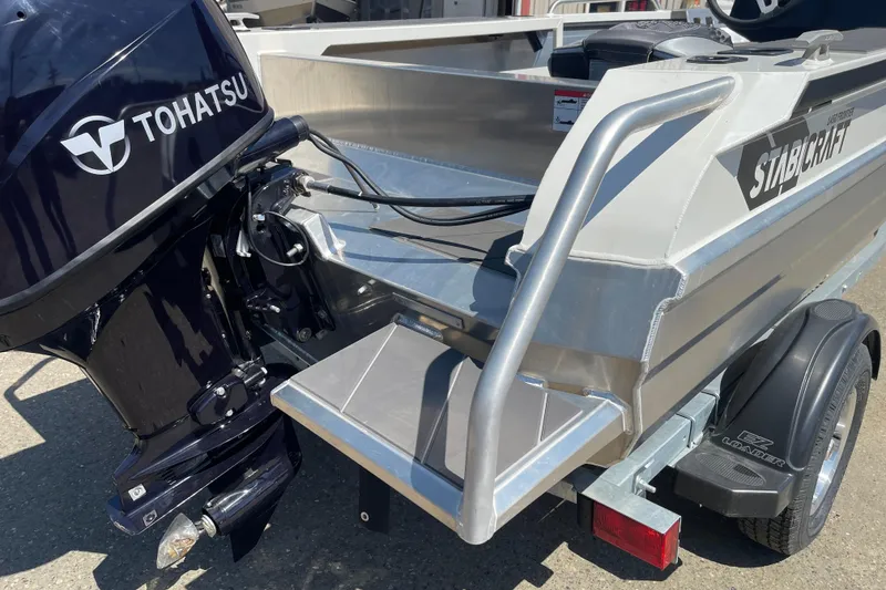 Slide: The Image of 2024 Stabicraft 1450 Frontier boat with Tohatsu outboard motor, rear view. - 5