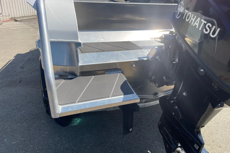 Slide: The Image of 2024 Stabicraft 1450 Frontier boat with Tohatsu outboard motor, rear view. - 7