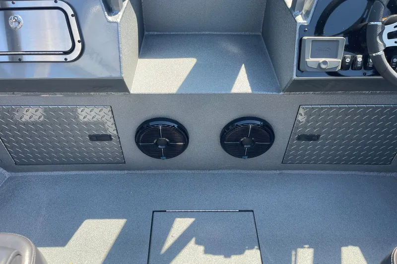 Slide: The Image of Interior of 2025 Excel Buoy 10 boat with speakers and diamond plate panels. - 25