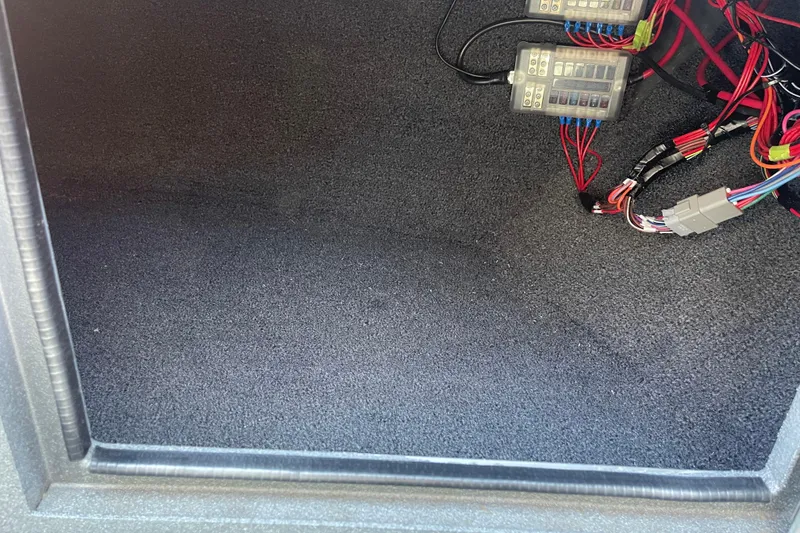 Slide: The Image of Interior view of 2025 Excel Buoy 10 with wiring and fuse boxes. - 36