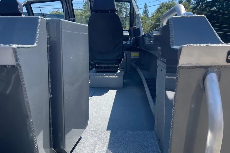 Slide: The Image of Interior view of 2025 Excel Buoy 10 boat, featuring seating and metal construction. - 4