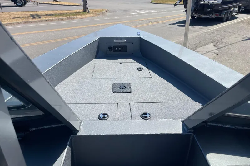 Slide: The Image of 2025 Excel Buoy 10 boat deck, featuring a sleek, modern design and storage compartments. - 42