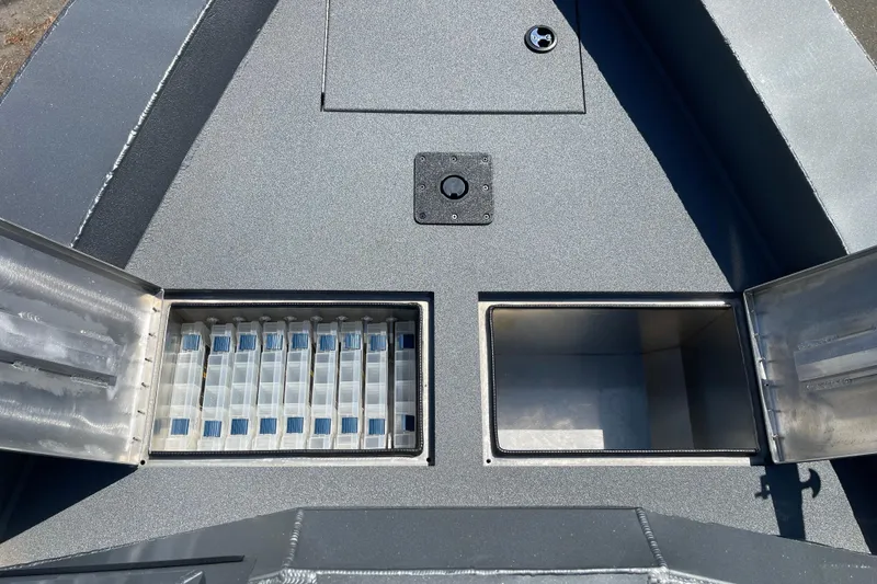 Slide: The Image of 2025 Excel Buoy 10 boat deck with open storage compartments. - 43