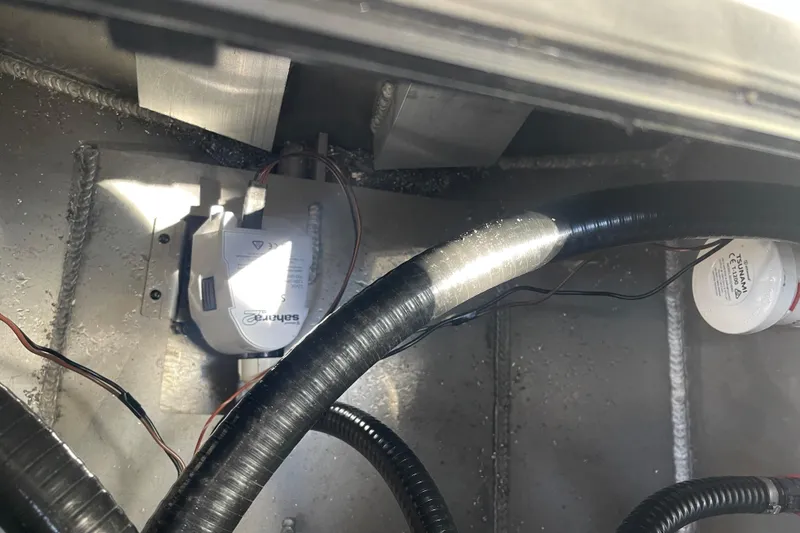 Slide: The Image of Interior view of 2025 Excel Buoy 10 boat showing wiring and components. - 7