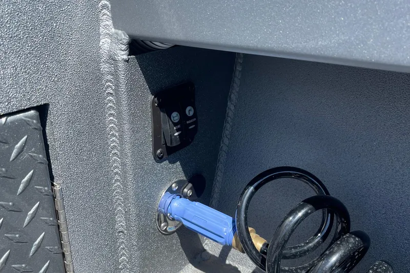 Slide: The Image of Control panel and hose in 2025 Excel Buoy 10 boat interior. - 9