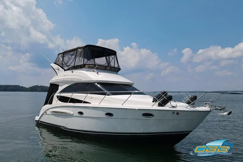 Slide: The Image of 2007 Meridian 341 Sedan yacht on calm water under a partly cloudy sky. - 10