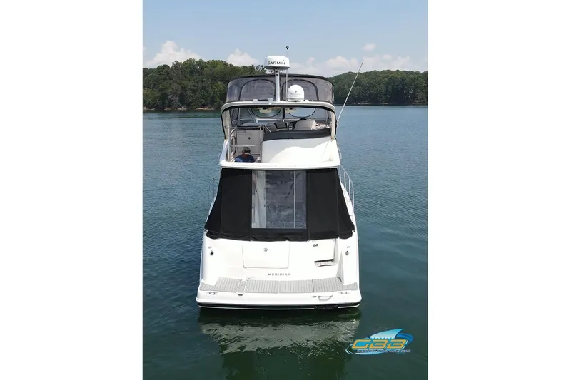 Slide: The Image of 2007 Meridian 341 Sedan yacht on calm water, rear view. - 11