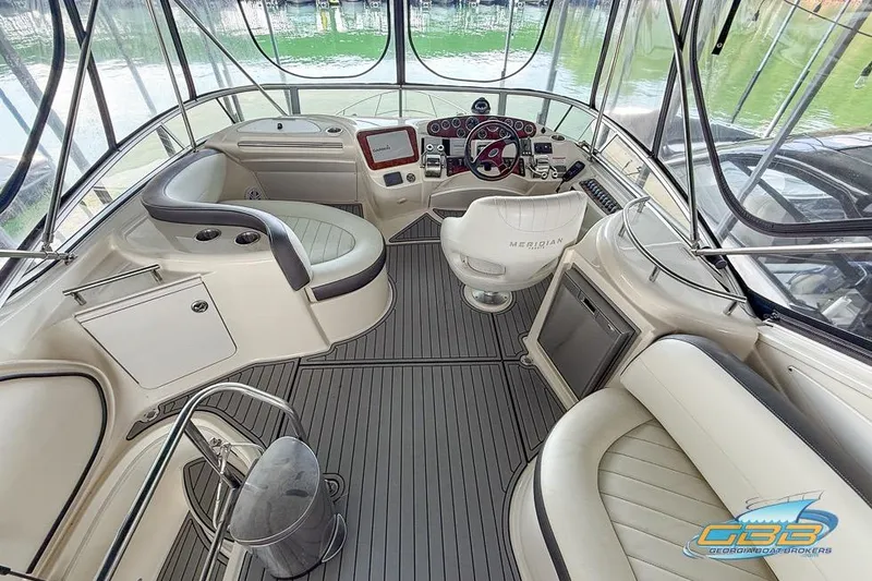 Slide: The Image of 2007 Meridian 341 Sedan yacht interior with helm, seating, and modern controls. - 12