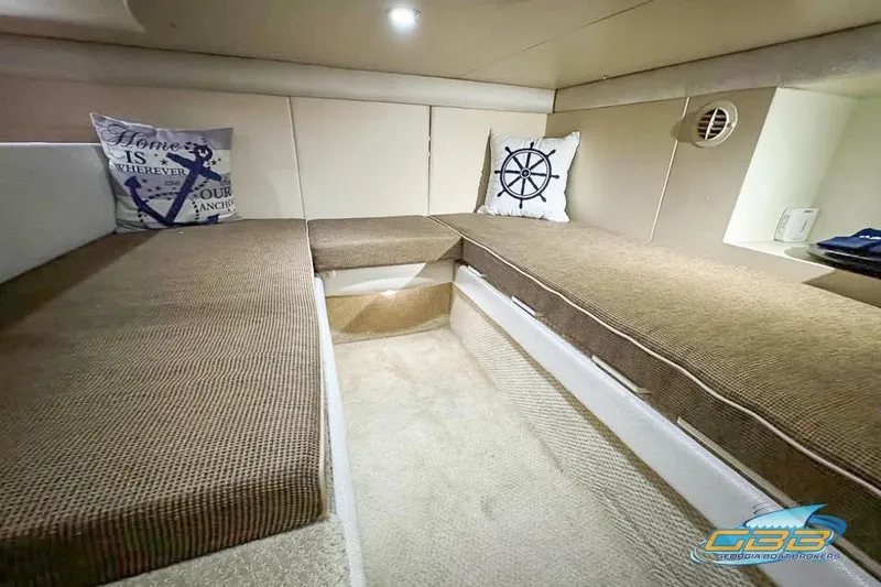 Slide: The Image of 2007 Meridian 341 Sedan interior with beige seating and nautical-themed pillows. - 19