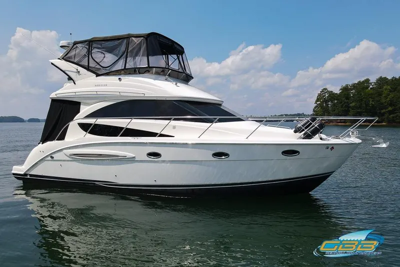 Slide: The Image of 2007 Meridian 341 Sedan yacht on calm water under a clear sky. - 2