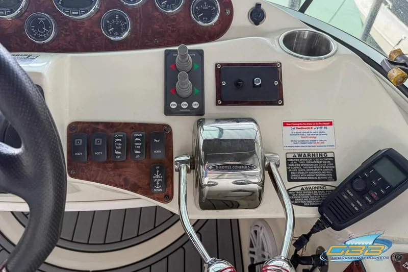 Slide: The Image of 2007 Meridian 341 Sedan helm with throttle controls, gauges, and communication device. - 20