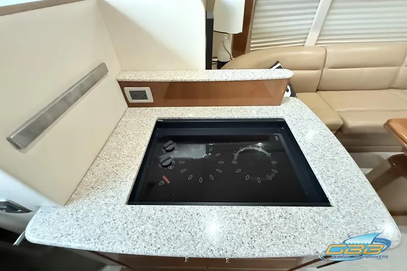 Slide: The Image of 2007 Meridian 341 Sedan interior with modern kitchen countertop and stove. - 23