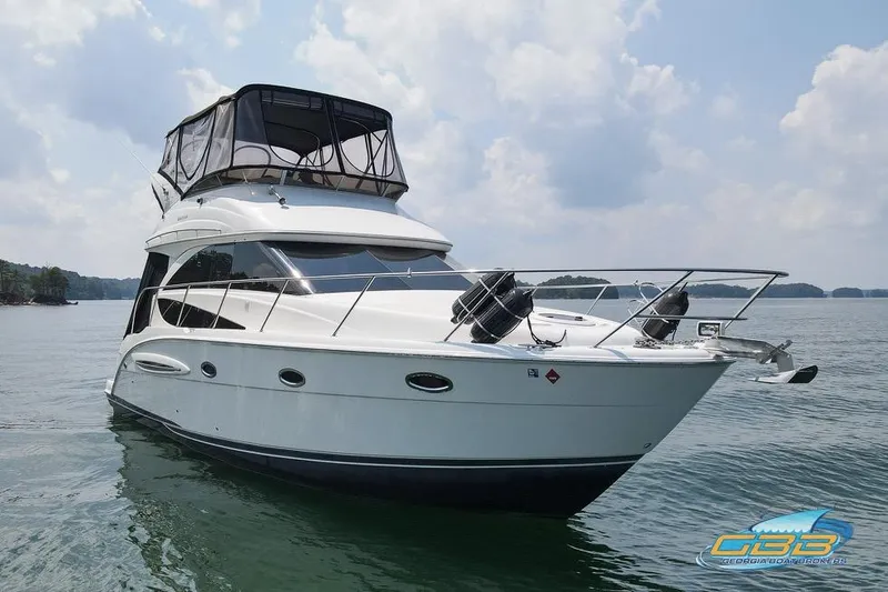 Slide: The Image of 2007 Meridian 341 Sedan yacht on calm water under a partly cloudy sky. - 3