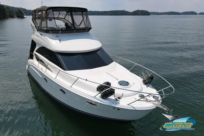 Slide: The Image of 2007 Meridian 341 Sedan yacht on calm water, featuring sleek design and spacious deck. - 9