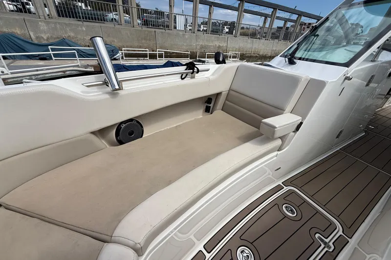 Slide: The Image of 2023 Boston Whaler 320 Vantage interior with beige seating and sleek design. - 25