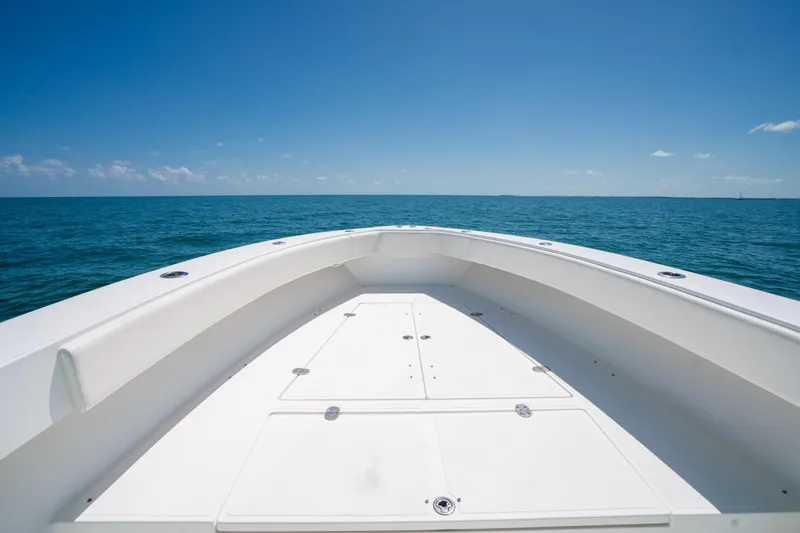 Slide: The Image of Bow view of 2006 Venture 39 Open boat on open sea under clear blue sky. - 10