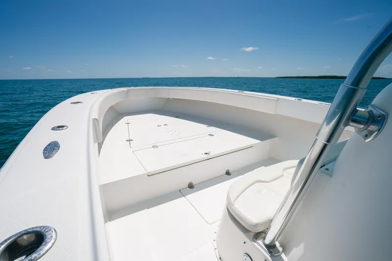 Slide: The Image of 2006 Venture 39 Open boat on calm ocean under clear blue sky. - 11
