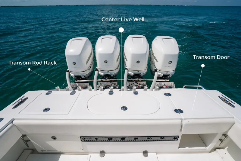 Slide: The Image of 2006 Venture 39 Open boat with four engines, transom rod rack, and center live well. - 16