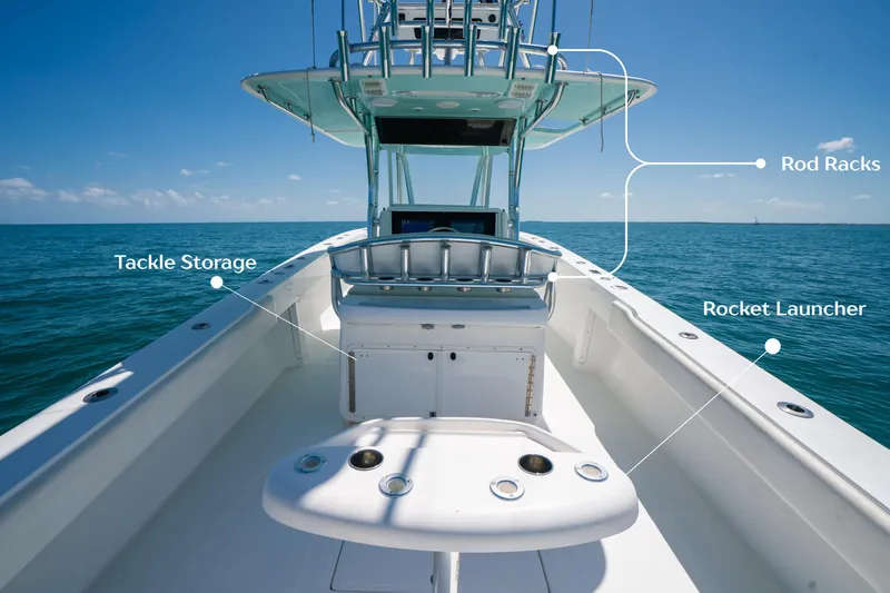 Slide: The Image of 2006 Venture 39 Open boat with rod racks, tackle storage, and rocket launcher on open sea. - 17