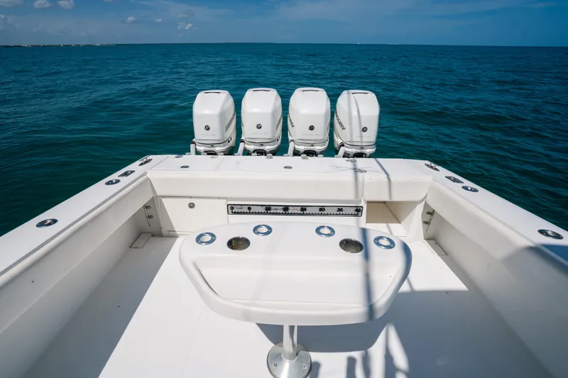 Slide: The Image of 2006 Venture 39 Open boat with four engines, ocean view, and fishing setup. - 18
