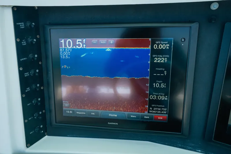 Slide: The Image of Boat navigation display showing depth and GPS data on a 2006 Venture 39 Open. - 23