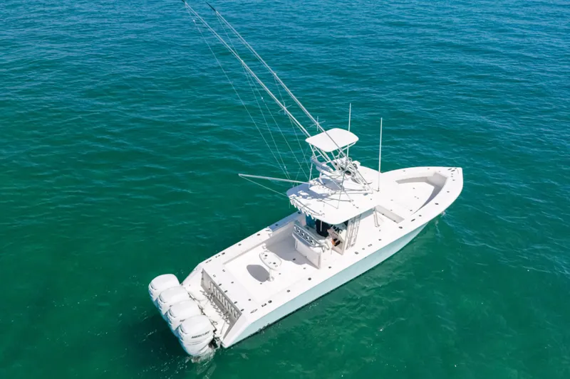 Slide: The Image of 2006 Venture 39 Open boat on clear blue water, aerial view. - 3
