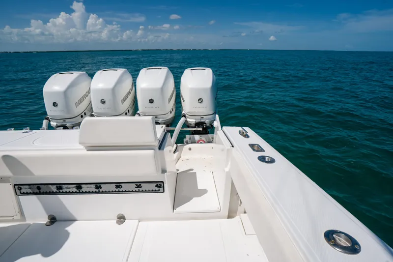 Slide: The Image of 2006 Venture 39 Open boat with four Mercury outboard engines on open sea. - 31